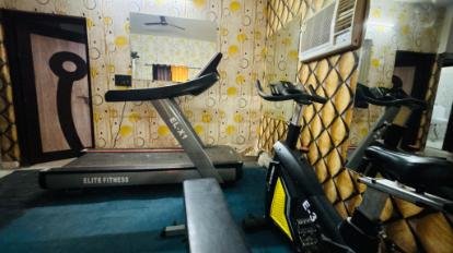 In-house fitness room with treadmill and cycle